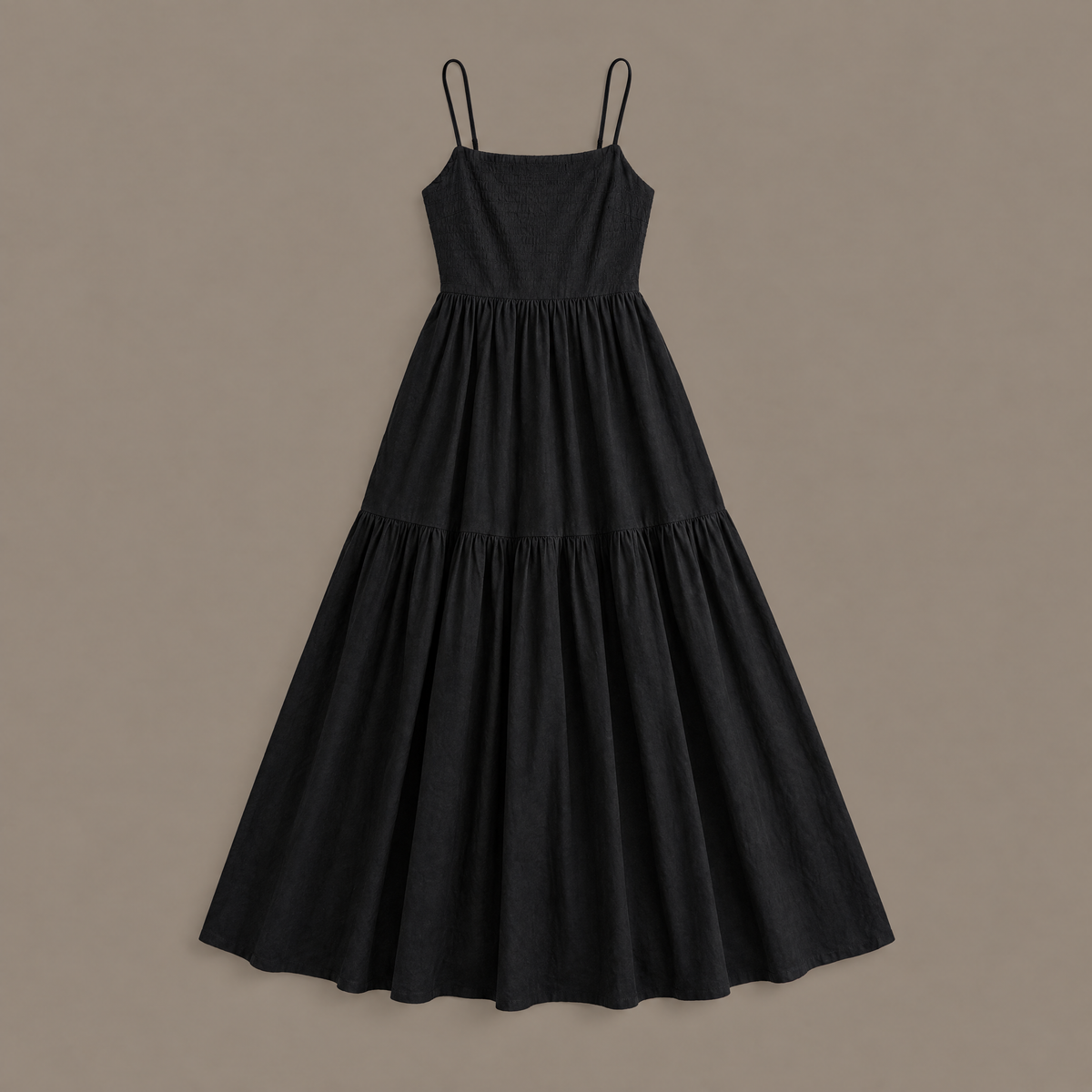 The black tiered maxi dress photographed on its own