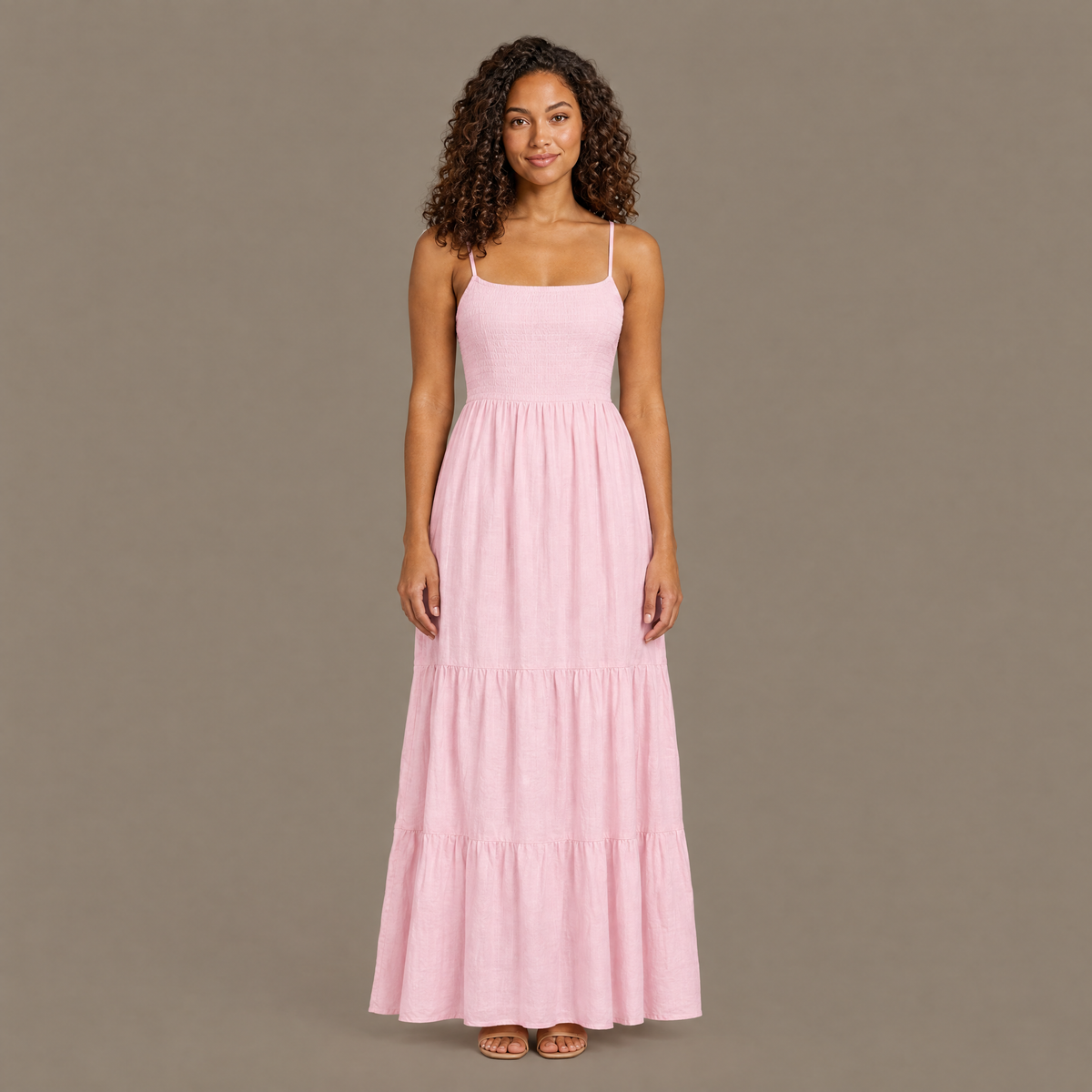 Woman wearing the pink backless tiered maxi dress, front view