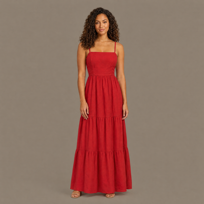 Woman wearing the red backless tiered maxi dress, front view