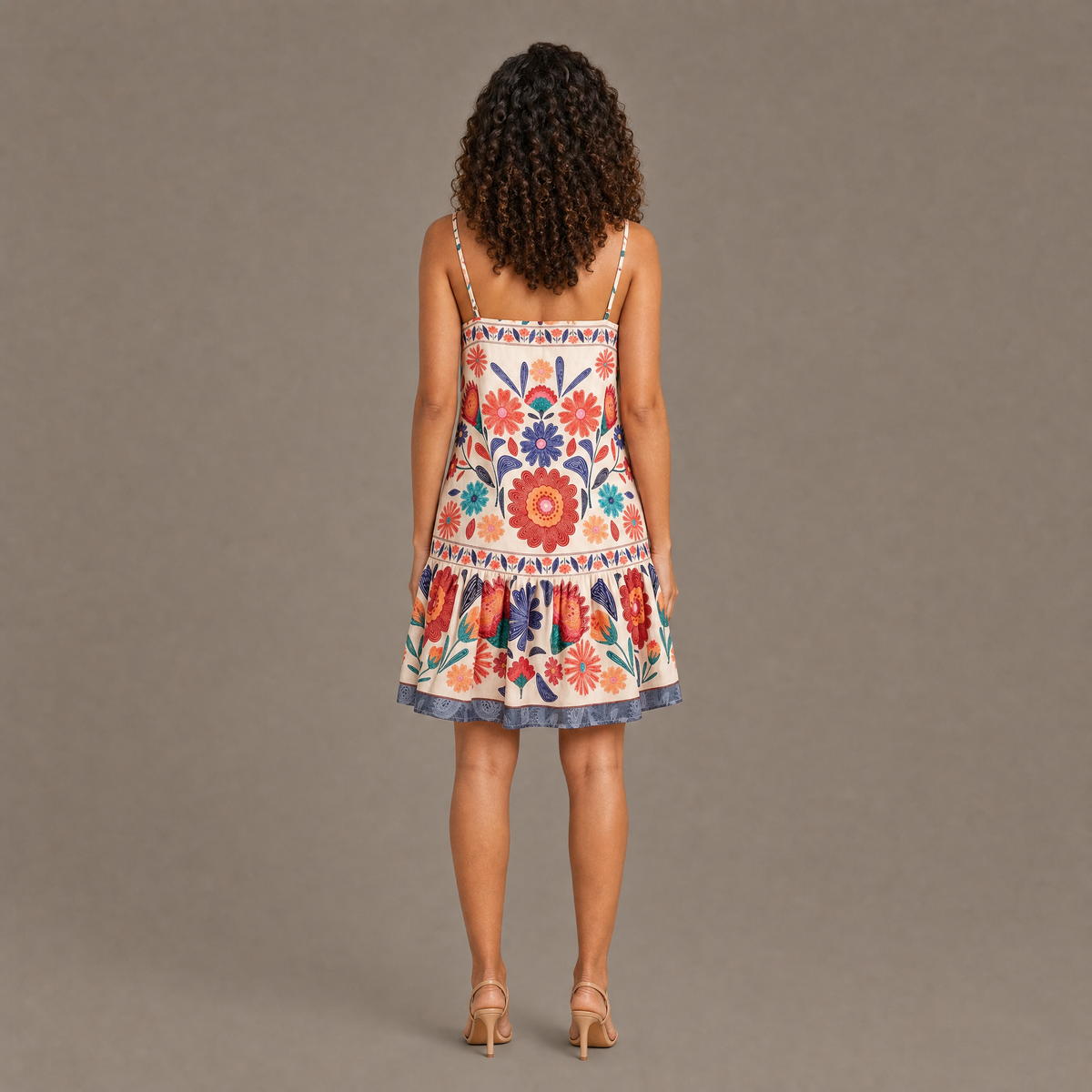 Back view of the orange bloom print spaghetti strap dress