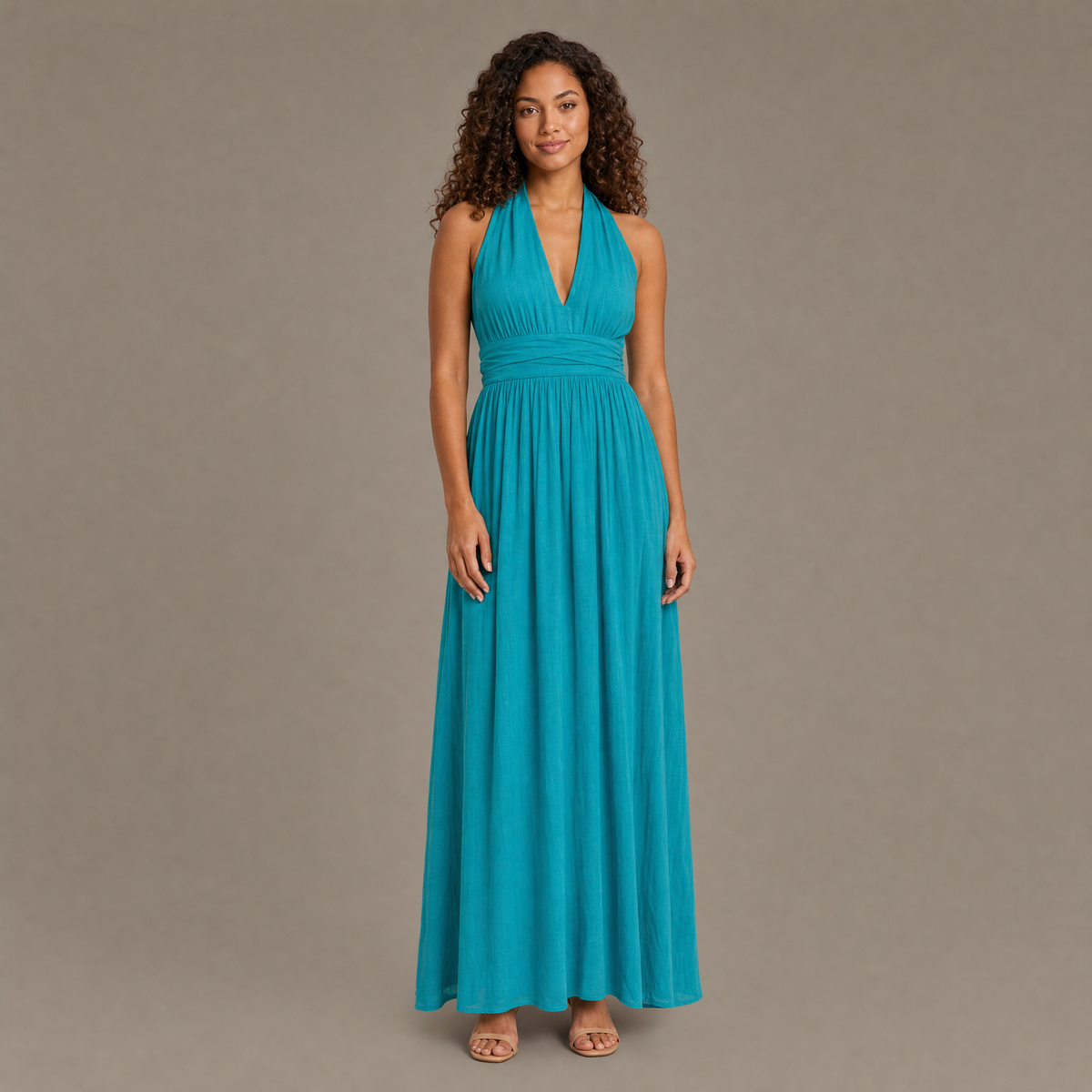 Woman wearing the teal boho cotton linen halter maxi dress, front view