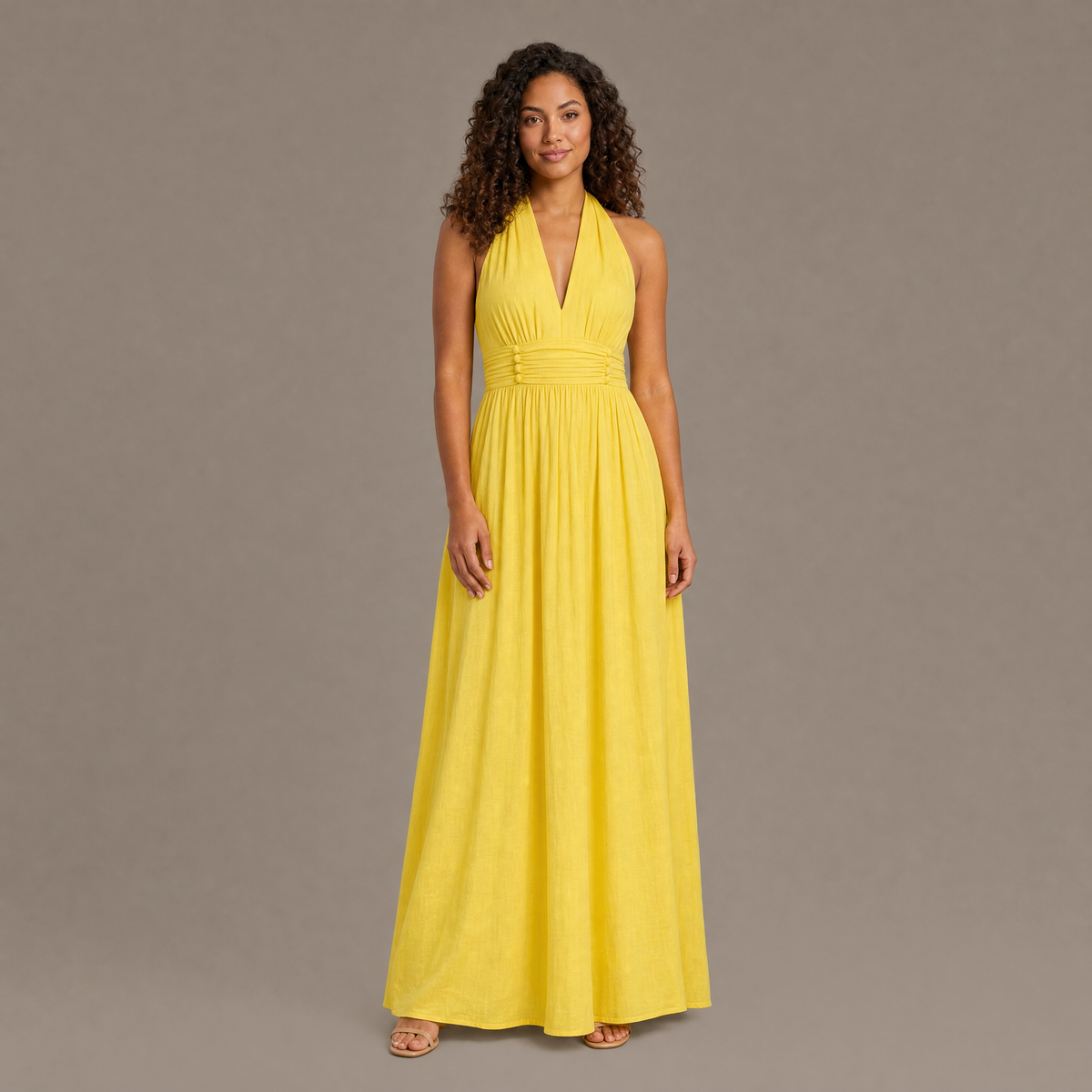 Woman wearing the yellow boho cotton linen halter maxi dress, front view
