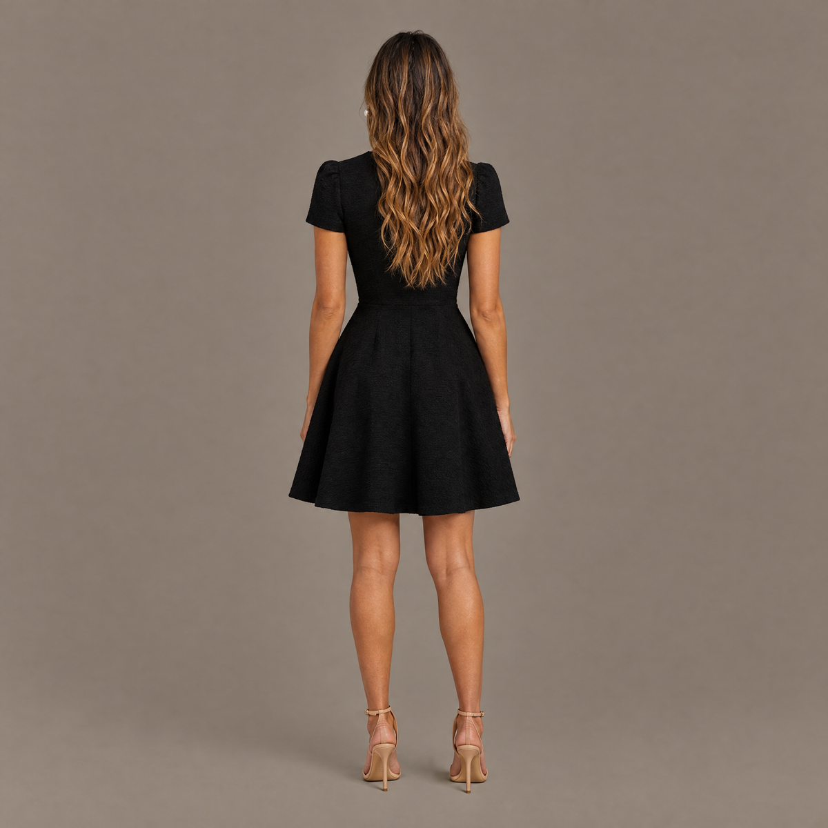 Back view of the black high neck fit and flare dress