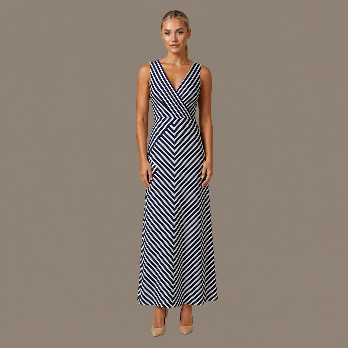 Woman wearing the navy stripe sleeveless midi dress, front view