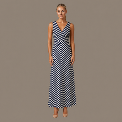 Woman wearing the navy stripe sleeveless midi dress, front view