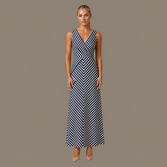 Woman wearing the navy stripe sleeveless midi dress, front view