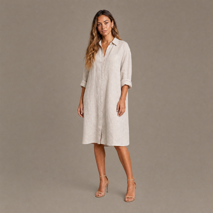 Woman wearing the natural linen oversized button down shirt dress, front view
