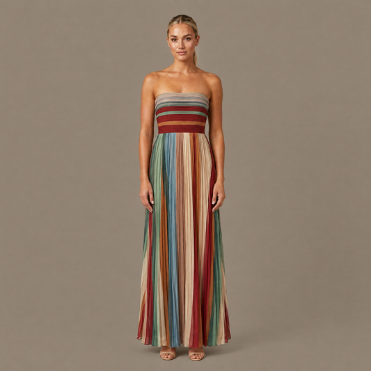 Woman wearing the pleated striped strapless maxi dress, front view