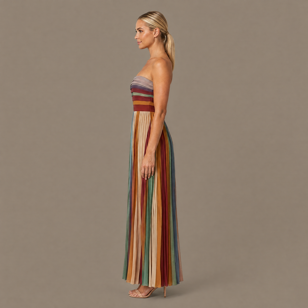 Side profile of the pleated striped strapless maxi dress
