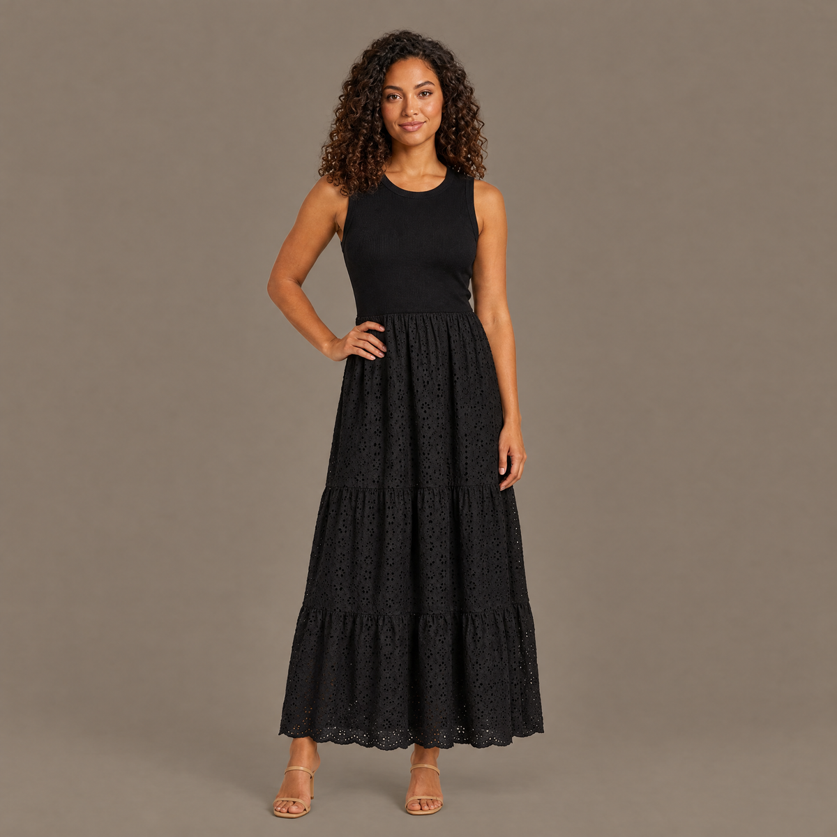 Woman wearing the black ribbed bodice eyelet lace maxi dress, front view