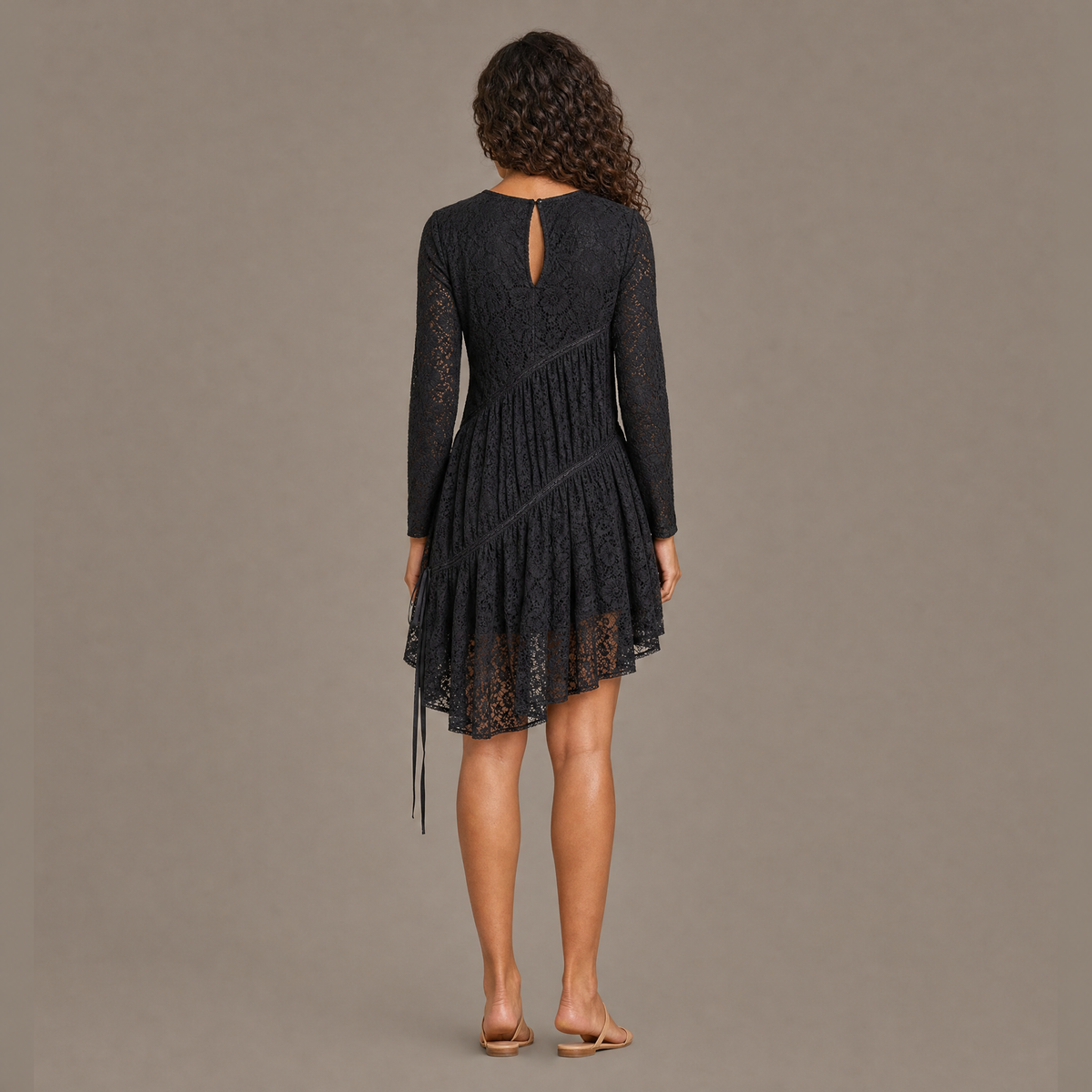 Back view of the coal black ruched tiered lace midi dress