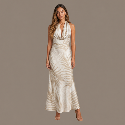 Woman wearing the natural tropical print satin maxi dress, front view
