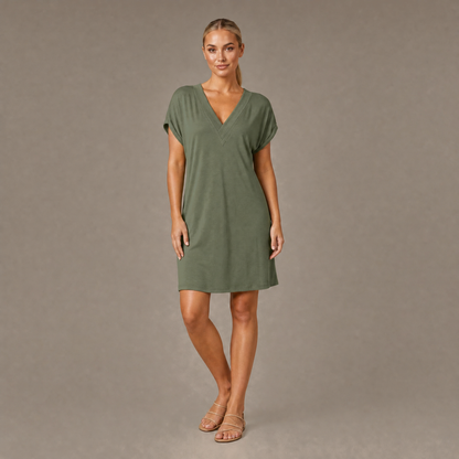 Woman wearing the green V neck short sleeve casual dress, front view