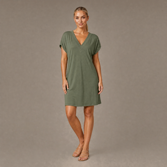 Woman wearing the green V neck short sleeve casual dress, front view